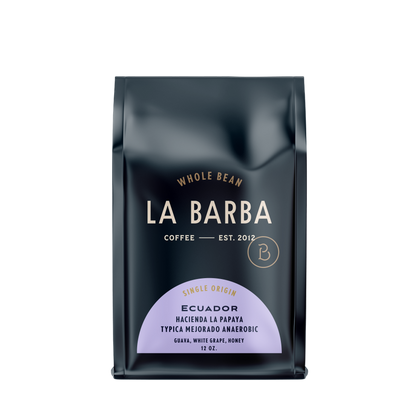 Load image into Gallery viewer, The image features a 12oz bag of La Barba Coffee, specifically their Ecuador Hacienda La Papaya, Typica Mejorado Anaerobic. The bag is designed with a dark background, prominently displaying the brand name "La Barba" in large, elegant letters. It highlights the coffee's origin, Ecuador, along with a description of the flavor profile, including notes of guava, white grape, and honey. The design exudes a premium and modern feel with a minimalist, sophisticated look.