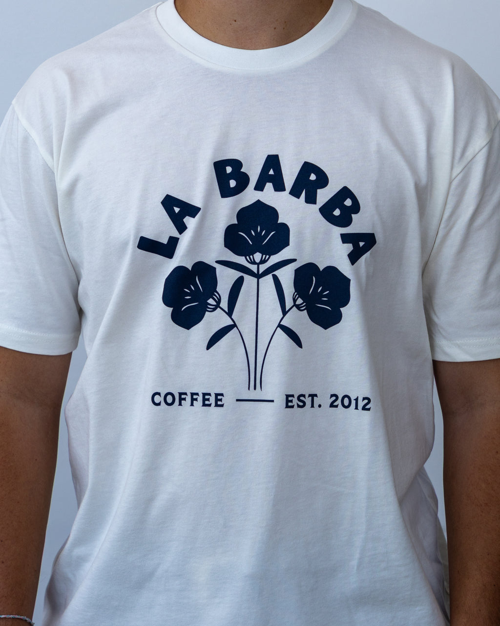 White t-shirt with 'La Barba Coffee' logo on a plain background