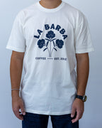 Person wearing a white t-shirt with 'La Barba Coffee' logo on a plain background
