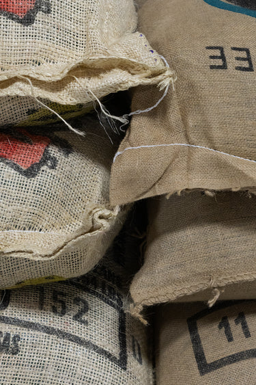 Close-up of burlap sacks with numbers printed on them