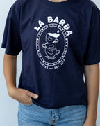 Navy blue t-shirt with 'La Barba Coffee' logo worn by a person against a light gray background