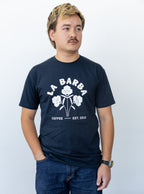 Man wearing a navy blue t-shirt with 'La Barba Coffee' logo on a white background
