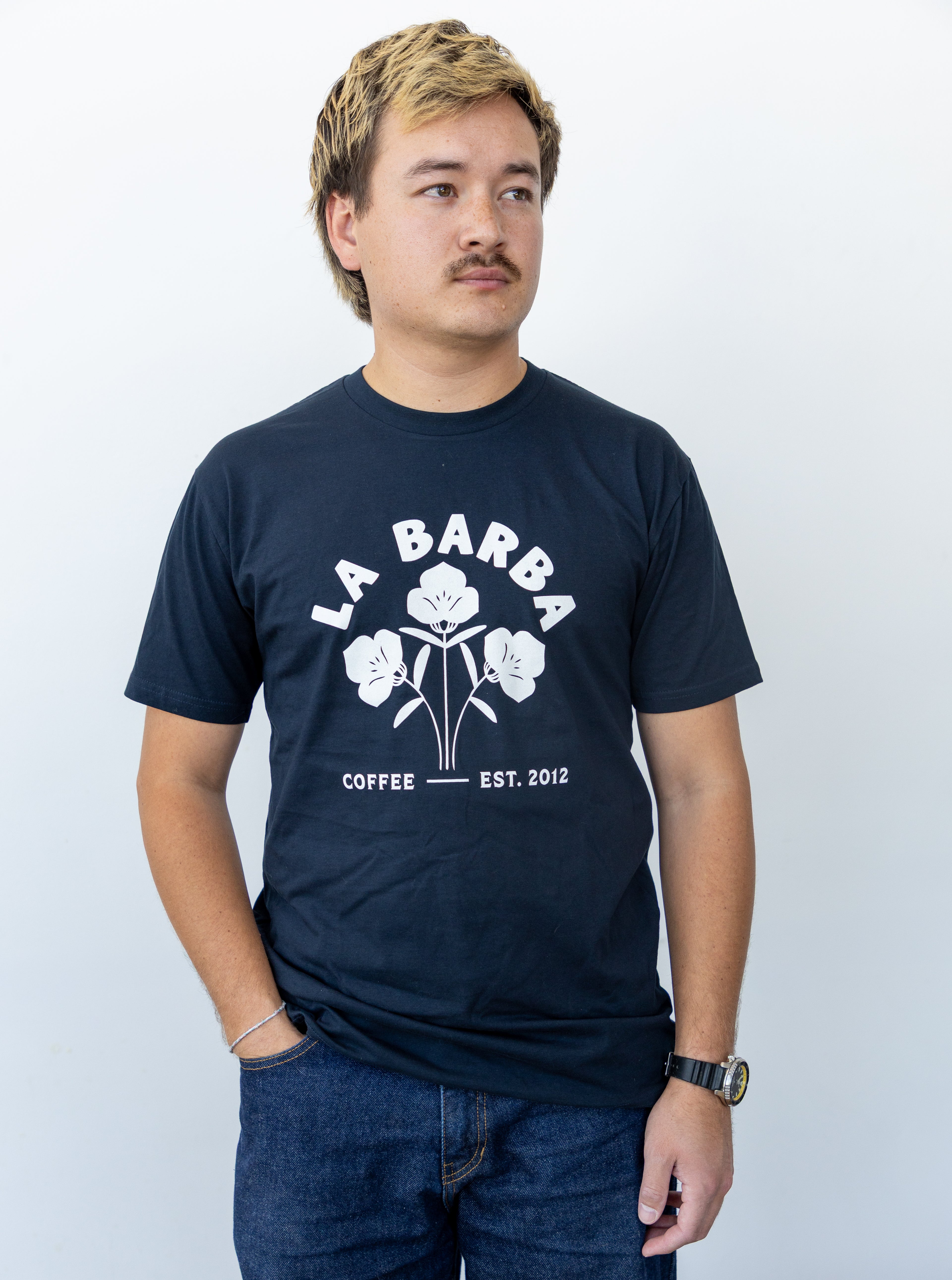 Man wearing a navy blue t-shirt with 'La Barba Coffee' logo on a white background
