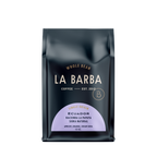 The image features a 12oz bag of La Barba Coffee, specifically their Ecuador Hacienda La Papaya, Sidra Natural. The bag is designed with a dark background, prominently displaying the brand name "La Barba" in large, elegant letters. It highlights the coffee's origin, Ecuador, along with a description of the flavor profile, including notes of apricot, orange, and cream soda. The design exudes a premium and modern feel with a minimalist, sophisticated look.