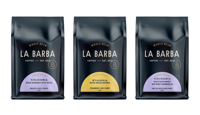 Three La Barba Coffee single-origin whole-bean bags displayed side by side in a clean product layout. The coffees featured include Colombia Diego Bermudez Letty Gesha with notes of pineapple, peach, and caramel; Ethiopia Basha Bekele Natural with notes of strawberry, lime, and cherry; and Colombia Sebastian Ramirez Red Honey Bourbon Aji with notes of mint tea, Meyer lemon, and honey. Premium specialty coffee packaging with modern, minimal design and colorful origin labels.