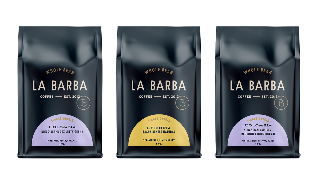 Three La Barba Coffee single-origin whole-bean bags displayed side by side in a clean product layout. The coffees featured include Colombia Diego Bermudez Letty Gesha with notes of pineapple, peach, and caramel; Ethiopia Basha Bekele Natural with notes of strawberry, lime, and cherry; and Colombia Sebastian Ramirez Red Honey Bourbon Aji with notes of mint tea, Meyer lemon, and honey. Premium specialty coffee packaging with modern, minimal design and colorful origin labels.
