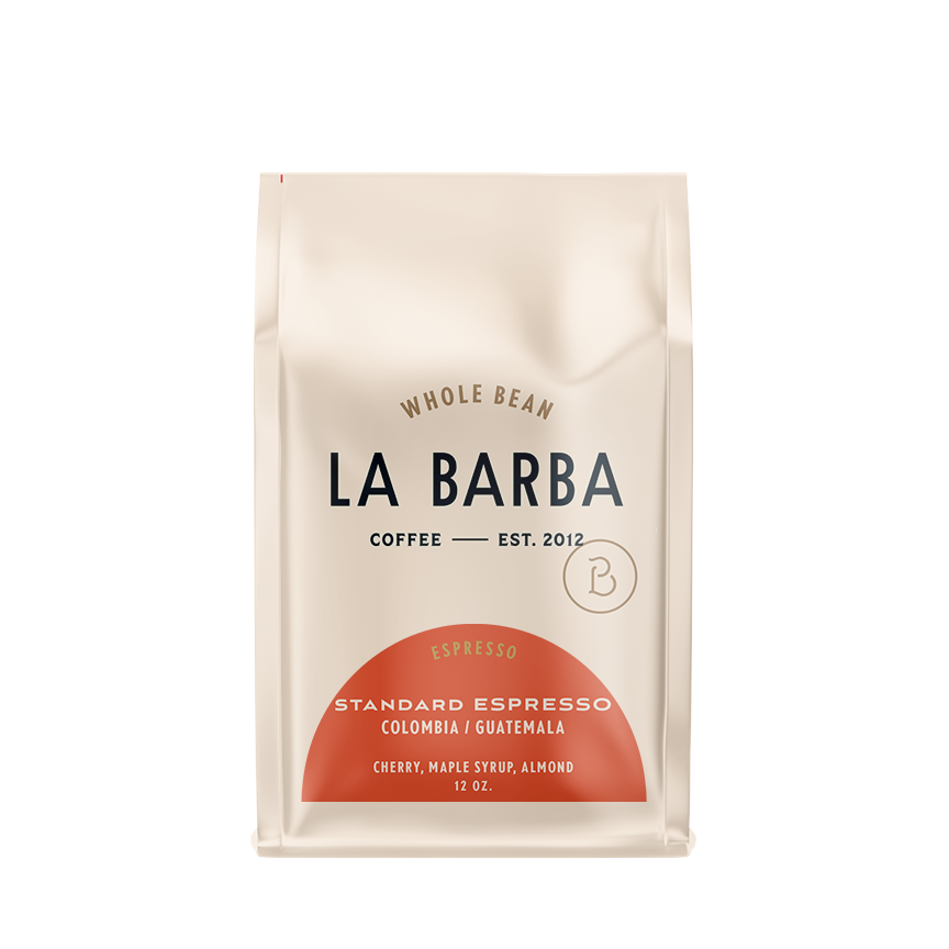 The image features a 12oz bag of La Barba Coffee, specifically their Standard Espresso Blend. The bag is designed with an ivory white background, prominently displaying the brand name 