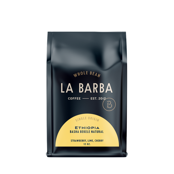 The image features a 12oz bag of La Barba Coffee, specifically their Ethiopia Basha Bekele Natural single-origin coffee. The bag is designed with a dark background, prominently displaying the brand name 