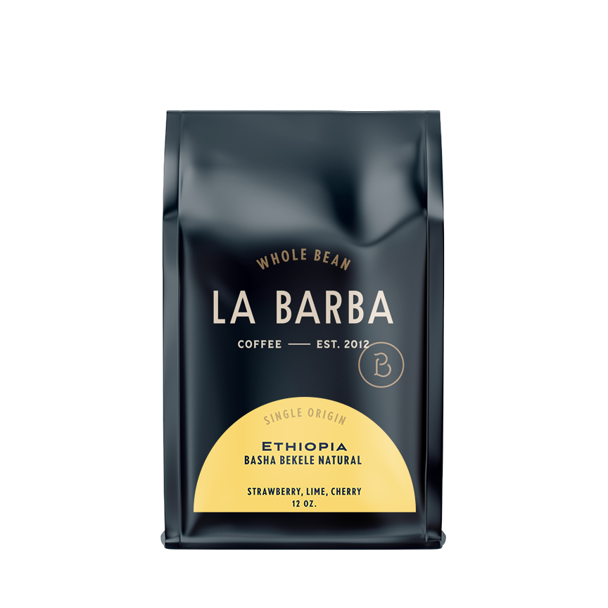 The image features a 12oz bag of La Barba Coffee, specifically their Ethiopia Basha Bekele Natural single-origin coffee. The bag is designed with a dark background, prominently displaying the brand name 