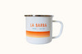 A white enamel mug with 'LA BARBA' printed in orange and red stripes on the side.