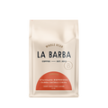A 12 oz bag of La Barba Whole Bean Coffee, Standard Espresso, in a cream-colored stand-up pouch with a terracotta-colored semi-circle graphic at the bottom and black text.